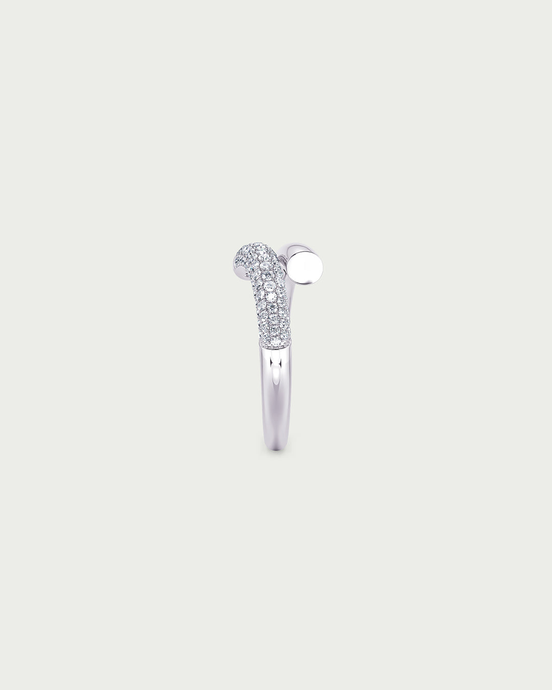 solo product shot of 18k white gold lab grown diamond wrap ring on off-white background
