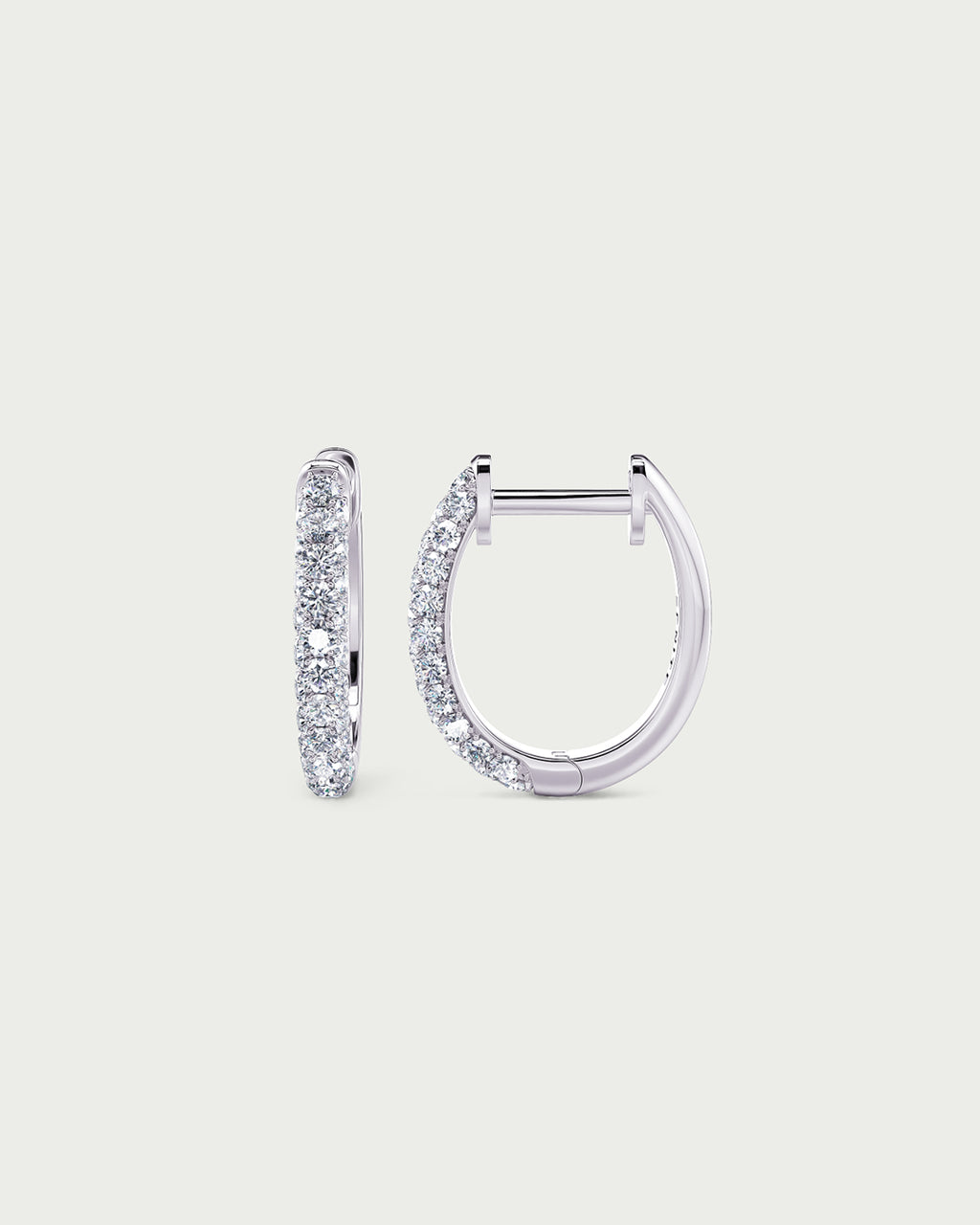 solo product shot of 18k white gold lab grown diamond hoop earrings on off-white background
