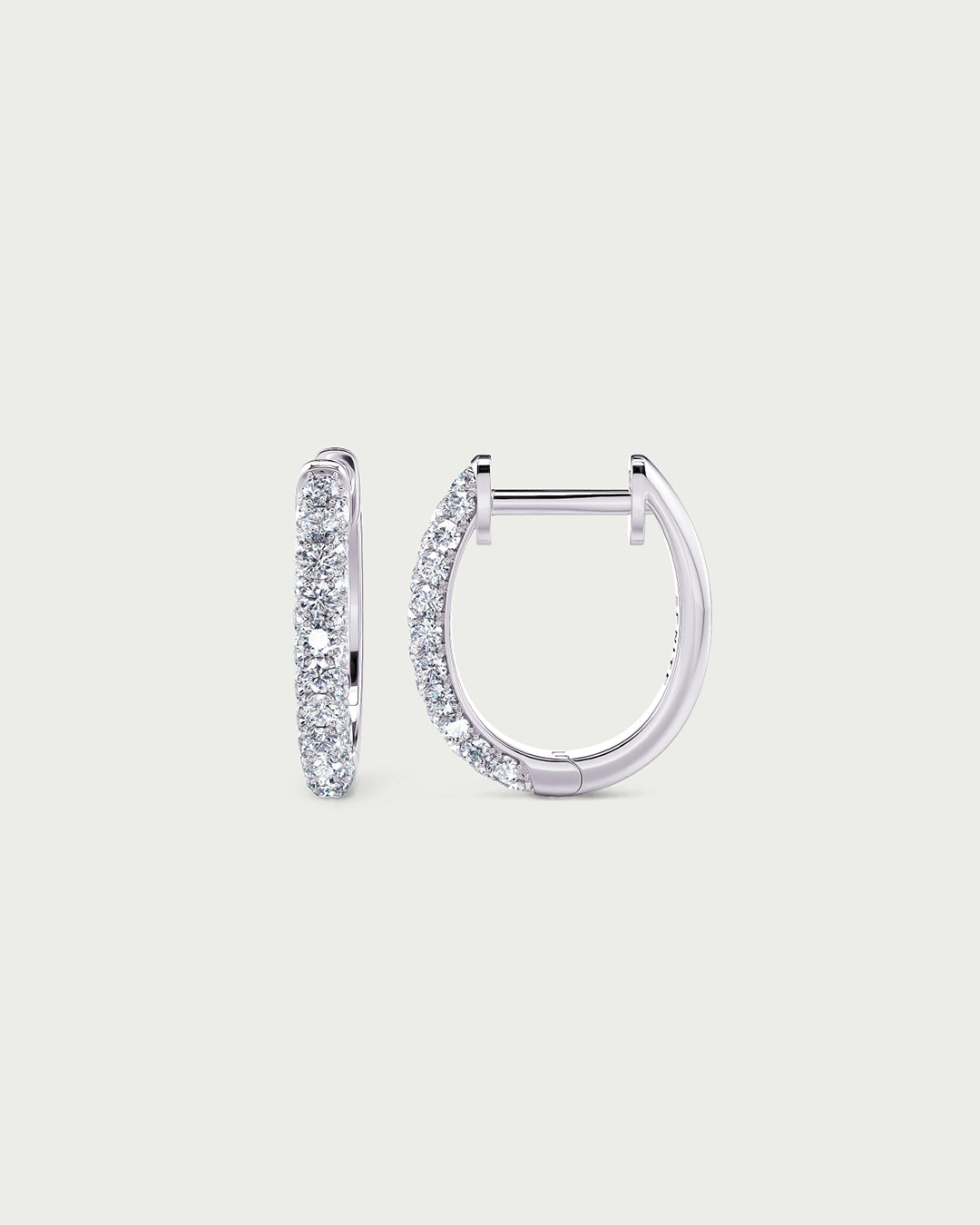 solo product shot of 18k white gold lab grown diamond hoop earrings on off-white background