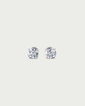 solo product shot of 18k white gold lab grown diamond stud earrings on off-white background