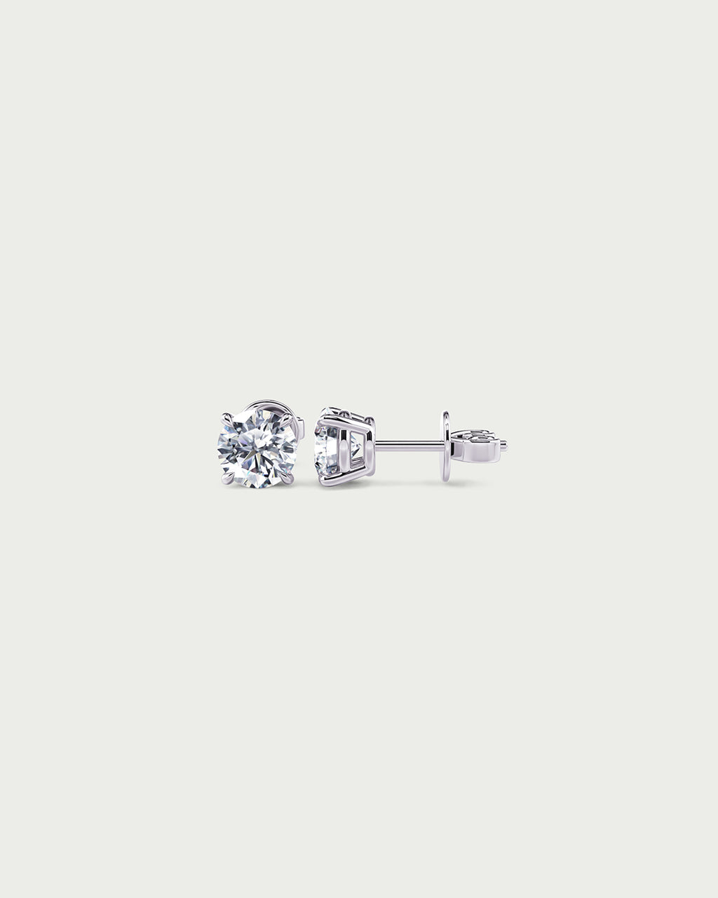 solo product shot of 18k white gold lab grown diamond stud earrings on off-white background