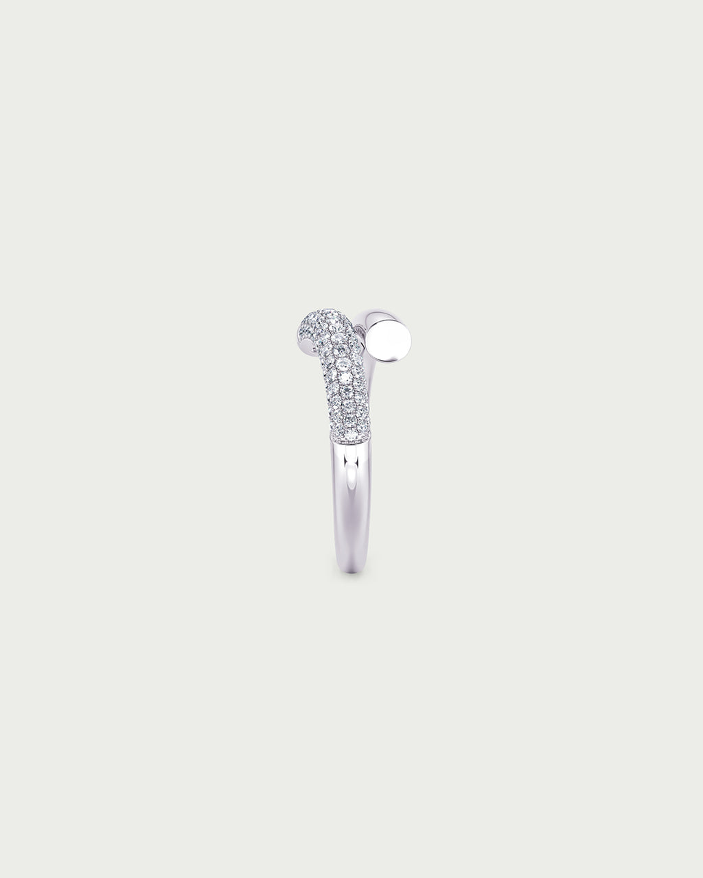 solo product shot of 18k white gold lab grown diamond wrap ring on off-white background