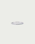 solo product shot of 18k white gold lab grown diamond half eternity band ring on off-white background