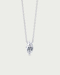 solo product shot of 18k white gold lab grown diamond marquise pendant necklace on off-white background